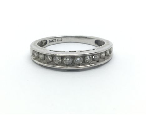 A 14ct white gold ring having a row of ten diamonds, approx 0.33ct, ring size approx J