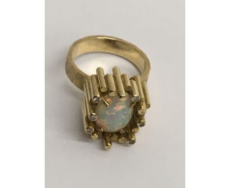 A 18 ct  contemporary style gold ring inset with opal Size L .Total weight 12 grams