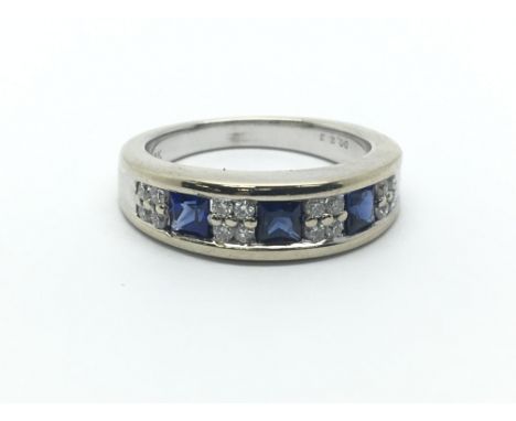 An 18ct white gold, diamond and sapphire ring, diamonds approx 0.23ct, ring size approx L/M