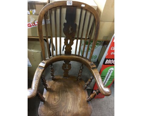 An elm stick back chair with solid seat on turned legs together with a mahogany occasional table the rectangular top above a 