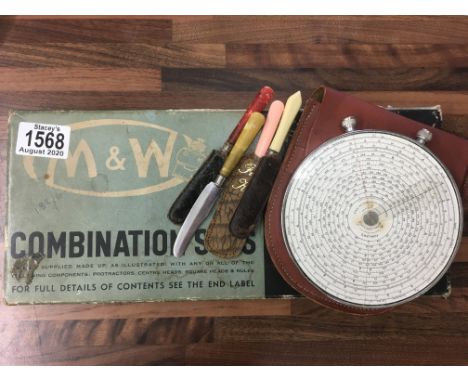 A Fowler's long scale calculator with paperwork and a boxed British Moore &amp; Wright combination protractor..