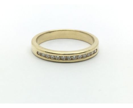 An 18ct yellow gold and diamond half eternity ring having a row of thirteen diamonds, ring size approx M