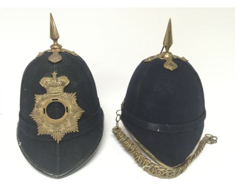 A late Victorian of Edwardian home service type military helmet and an old style police helmet with brass fittings. (2)