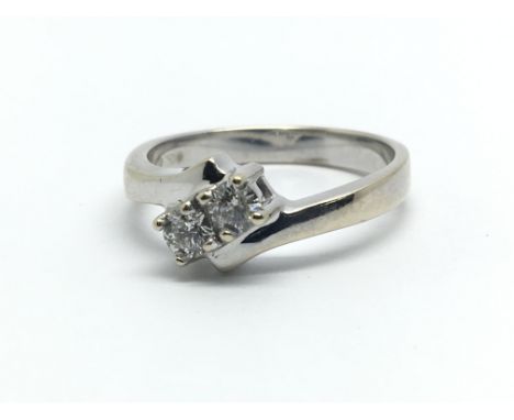 An 18ct white gold and two stone diamond ring, approx 0.33ct, ring size approx M/N