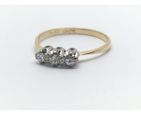 An 18ct yellow gold and three stone diamond ring, approx 0.15ct, ring size approx N