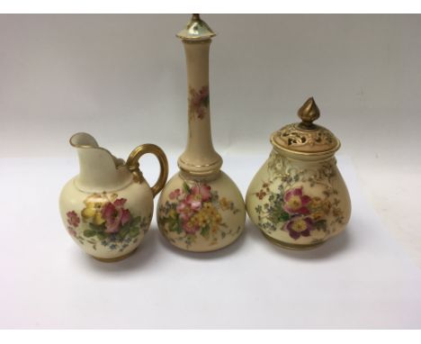 A collection of three Royal Worcester pieces comprising two vases and a jug decorated with flowers And foliage.