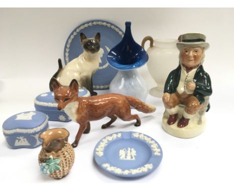 A collection of ceramics including a Beswick fox, Wedgewood blue and white jasperware etc.