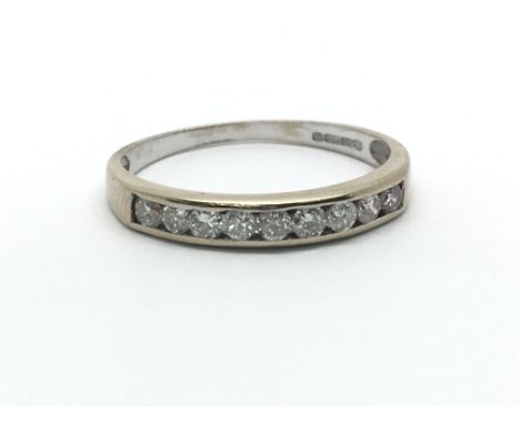 An 18ct white gold solitaire diamond half eternity ring, approx 0.33ct, size approx J/K