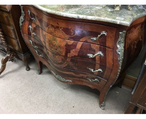 A French style Inlaid  commode the serpentine marble top above four drawers with ormolu mounts 90 cm by 48 cm. height 90 cm