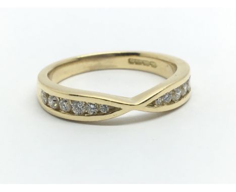 An 18ct yellow gold and twelve diamond half eternity ring, approx 0.25ct, ring size approx M/N
