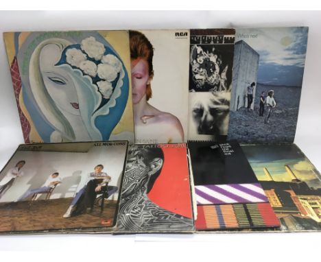 A large bag of vinyl records including The Rolling Stones, The Who, David Bowie and many more. Condition varies from poor to 