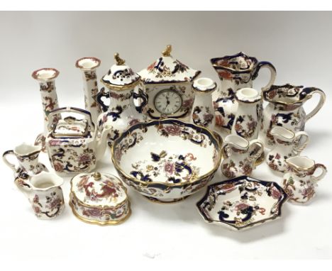 A collection of Masons Ironstone ceramics consisting of candlestick holders, jugs, bowls etc, in both blue and red colour way
