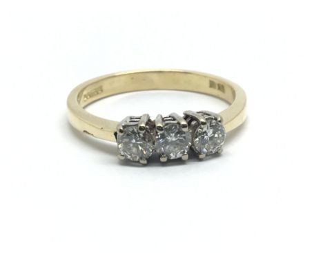 An 18ct yellow gold and three stone diamond ring, approx 0.50ct, ring size approx M