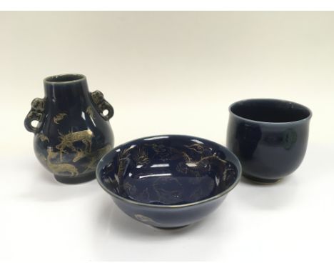 Three powder blue ceramic items, one decorated with giltwork dragons to the interior, one with bats and deers. The largest ap