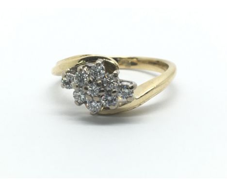 An 18ct yellow gold and nine stone diamond ring, approx 0.33ct, ring size approx J/K