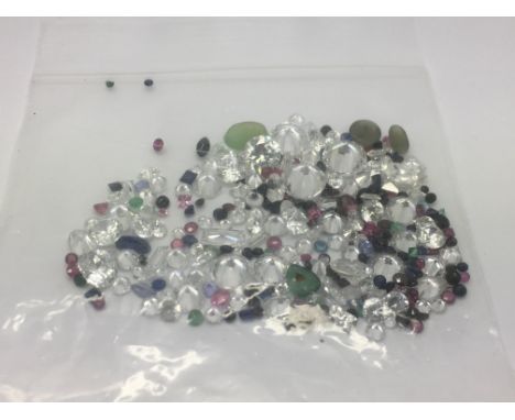 A bag of loose mixed stones including CZs, rubies, emeralds, sapphire and jade, approx 75.00ct.
