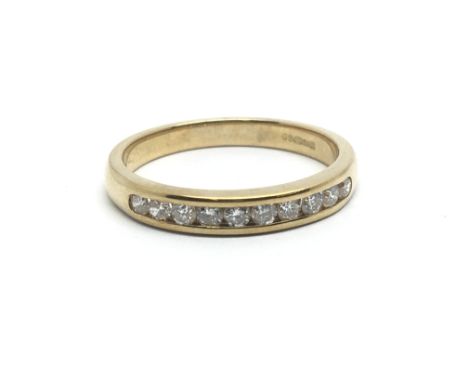 A 9ct yellow gold half eternity ring having a row of 10 diamonds, approx 0.33ct, ring size approx K