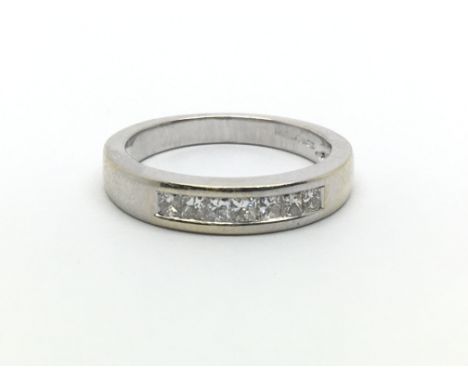 An 18ct white gold ring with seven princess cut diamonds, approx 0.20ct, ring size approx J