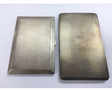 Two silver cigarette cases with engine turned decoration and gilt interiors, different assays.