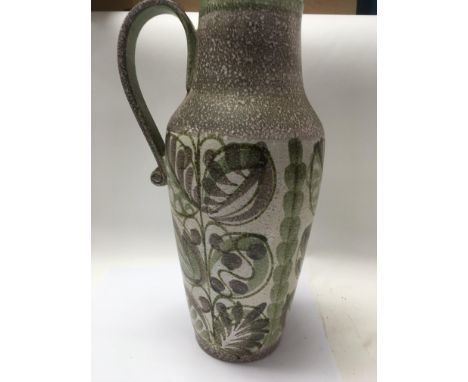 A Denby Glynn ware  pitcher decorated ingreen and brown glaze, impressed marks to the base .