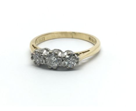 An 18ct yellow gold and three stone diamond ring, approx 0.33ct, ring size approx J/K