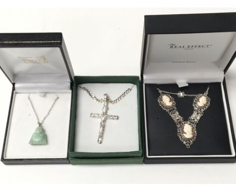 A silver Jesus on cross pendant on chain, a Jade Buddha on silver chain and an 800 silver 1950â€™s Cameo necklace, all in box
