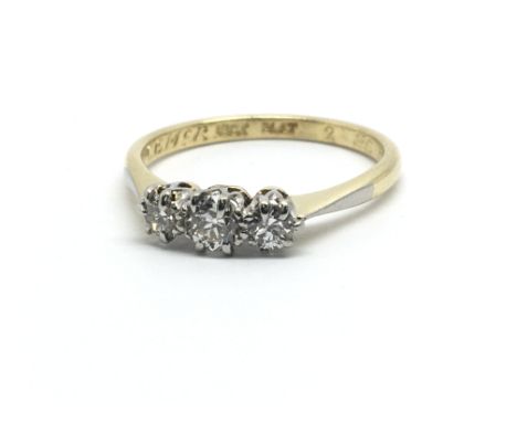 A vintage 18ct yellow gold three stone diamond ring, approx 0.20ct, ring size approx L/M