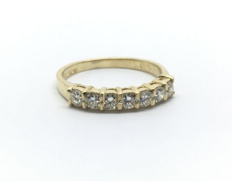 An 18ct yellow gold seven diamond half eternity ring, approx 0.55ct, ring size approx M