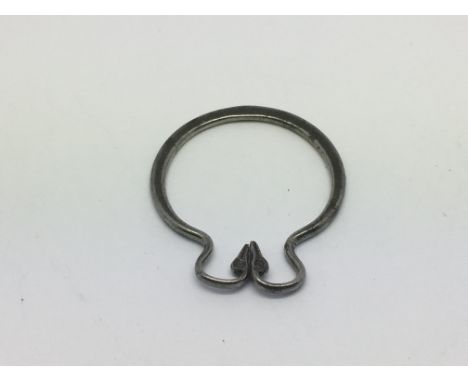 A rare antique steel ring decorated with swan heads.