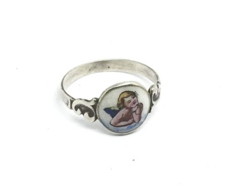 A vintage silver and enamel cherub ring, approx size N-O.