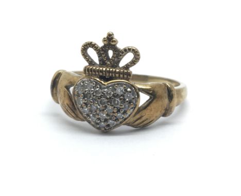 A 9ct yellow gold ring with Claddagh design, the heart having many small diamonds,ring size approx M/N