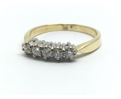 An 18ct yellow gold and five stone diamond ring, approx 0.25ct, ring size approx L