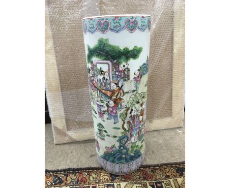 An Oriental stick stand decorated with figures in a garden setting, approx height 61cm.