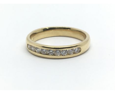 An 18ct yellow gold half eternity ring having a row of nine diamonds, approx 0.33ct, ring size approx M/N