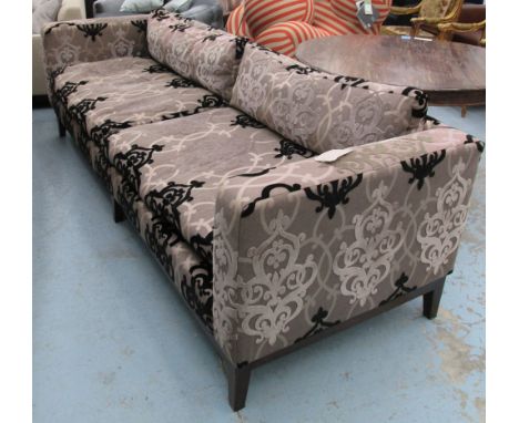 SOFA, of large proportions, two seater, on raised and patterned fabric on square supports from Carol Bird Interiors, 254cm L.