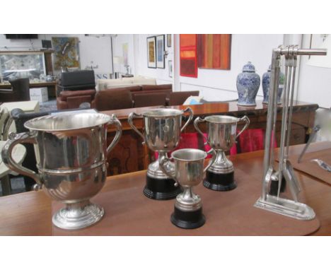 HEARTH TOOLS, various trophies and a champagne vessel, 60cm x 48cm H x 37cm largest.
