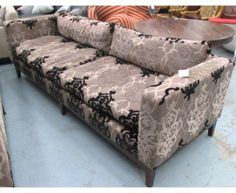 SOFA, of large proportions, two seater, on raised and patterned fabric on square supports from Carol Bird Interiors, 254cm L.