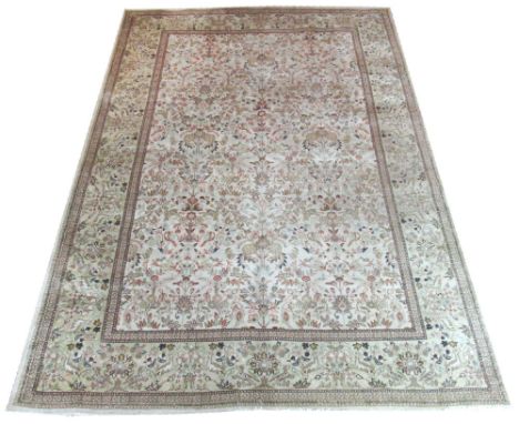 ANTIQUE PERSIAN TABRIZ CARPET, 292cm x 206cm, allover tree of life designs on an ivory field within corresponding guard strip