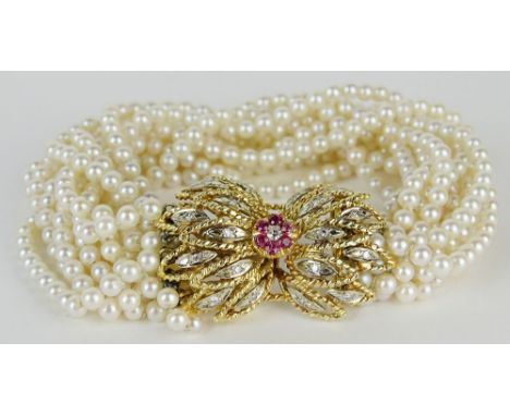 Lady's vintage multi strand pearl bracelet with approx. .50 carat diamond, .20 carat ruby and 14 karat yellow gold clasp. Pea