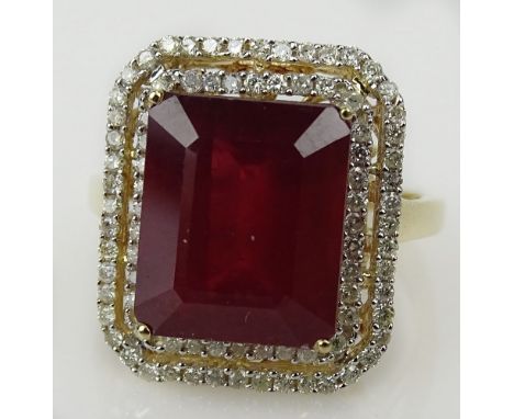 GGA Certified 9.74 Carat Ruby, 0.44 Carat Diamond 14 Karat Yellow Gold Ring. The natural ruby emerald cut and faceted measure