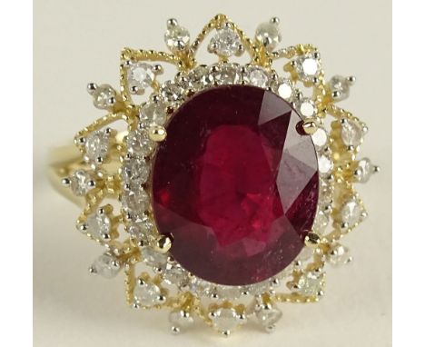 AIG Certified 5.95 Carat Ruby Diamond and 14K Yellow Gold Ring. The Ruby with vivid saturation of color, set in a .83 round b