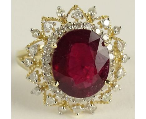 AIG Certified 5.95 Carat Ruby Diamond and 14K Yellow Gold Ring. The Ruby with vivid saturation of color, set in a .83 round b