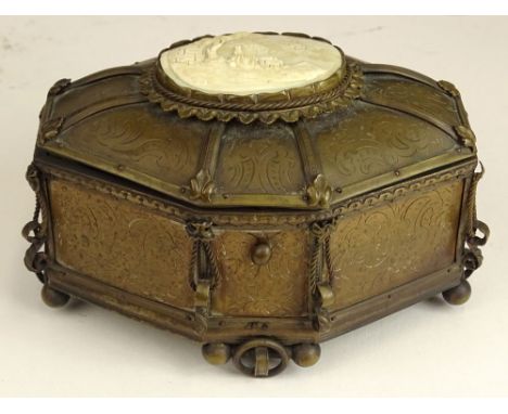 19th century Patinated white metal vanity box with carved ivory inset on top. Lined. Old repair to back ball feet, wear or in