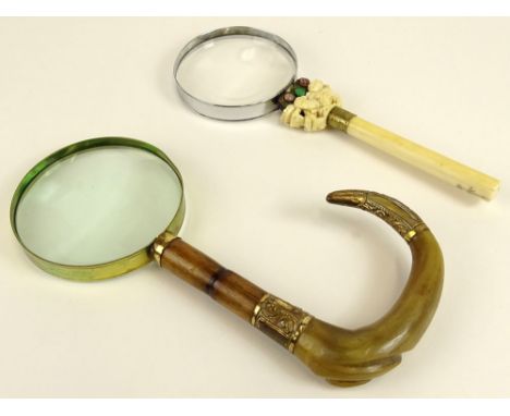 Lot of two (2) antique magnifying glasses. One with horn, wood and brass handle, 10 inches long the other with carved ivory a