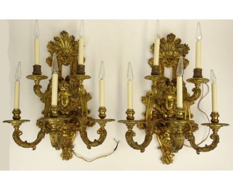 Pair of antique figural ormolu four (4) light sconces. Very ornate. Unsigned. Good condition. Measures 26-1/2 inches tall, 21