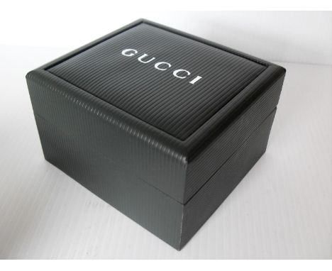 A ladies Gucci stainless steel bangle wristwatch 1400L with original box and warranty, needs battery 