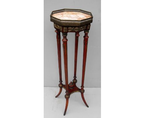 A French 19th century walnut octagonal bust or jardinière stand with marble inset top, pierced brass gallery, ormolu mounts t