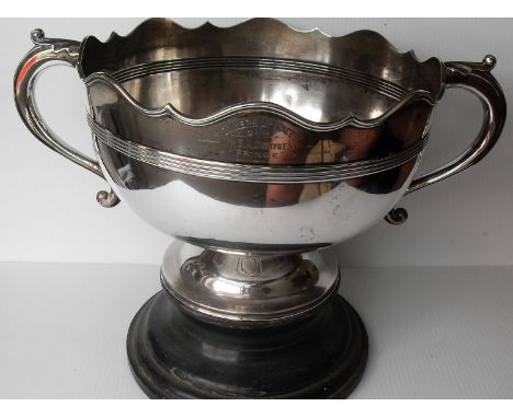 An Edwardian silver two-handled monteith or punch bowl with wavy rim, fluted band to girth on a spreading foot by William Hut