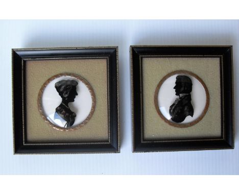 H. C. Bassett, a pair of reverse on domed glass portrait silhouettes of a lady and gentleman, 9.5 x 9.5 cm