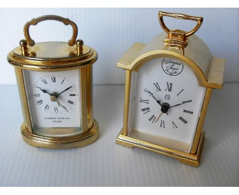 A London Clock Co. miniature brass-cased carriage clock / alarm, 8.5 cm H without handle, together with another similar by Te